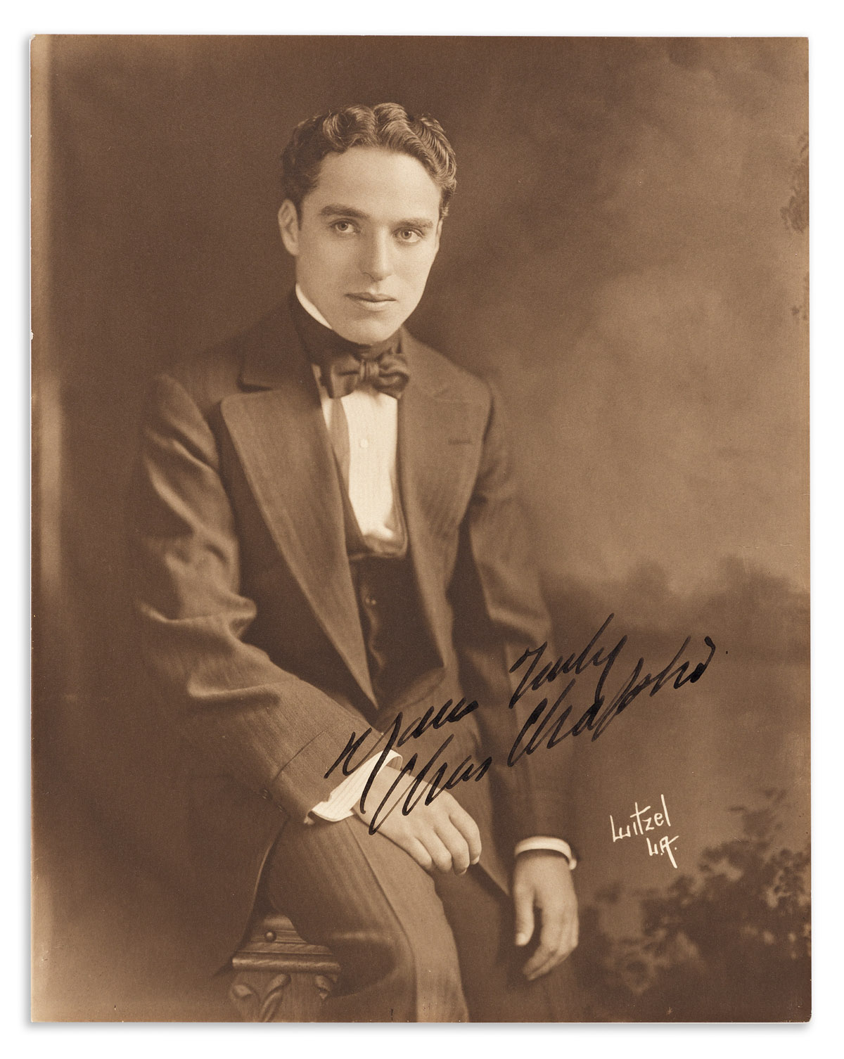 CHAPLIN, CHARLIE. Photograph Signed and Inscribed, Your Truly / Chas Chaplin,